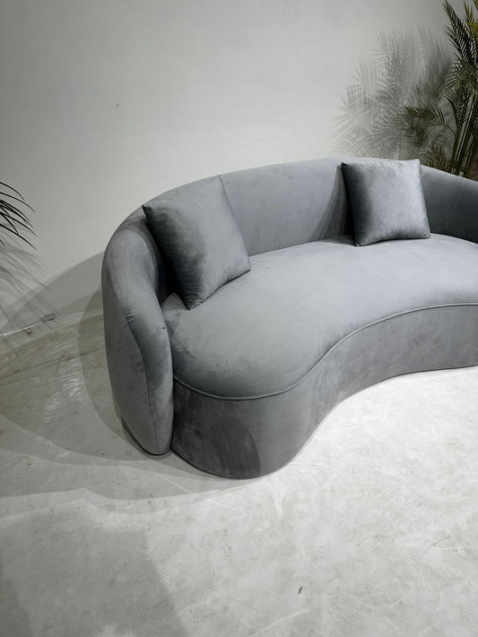 grey curved sofa
