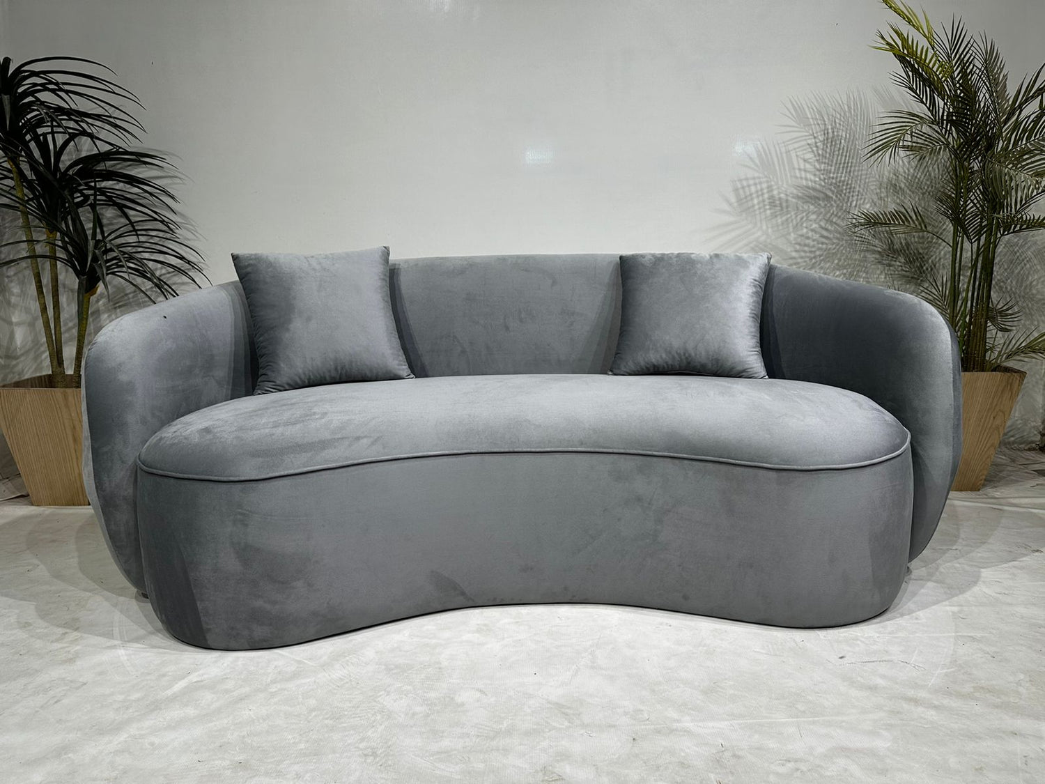 grey curved sofa