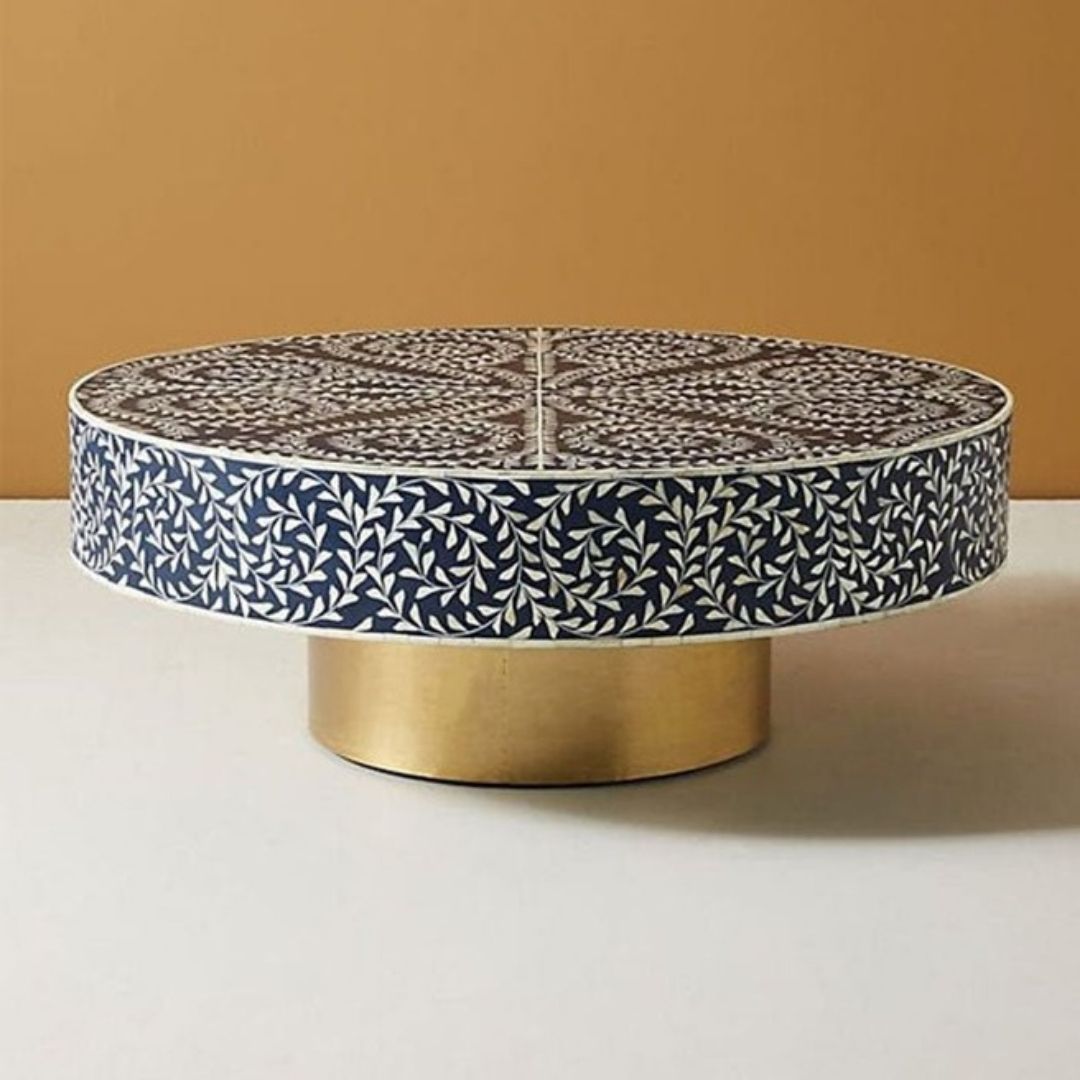 Moroccan inspired round coffee table with a base of gold