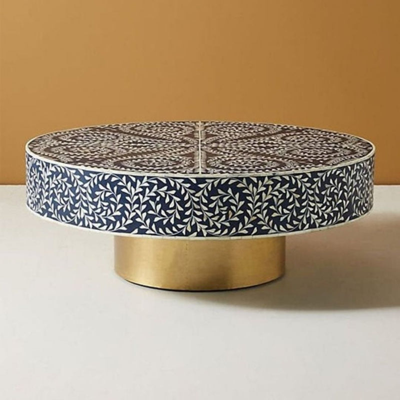 Moroccan inspired round coffee table with a base of gold