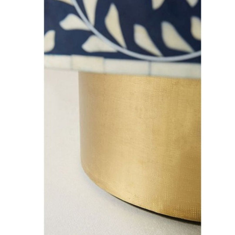 Moroccan inspired round coffee table with a base of gold